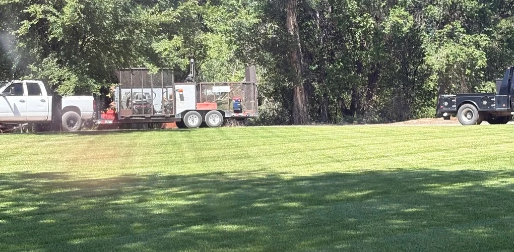 ProScape crew truck, trailer and mowing equipment on site